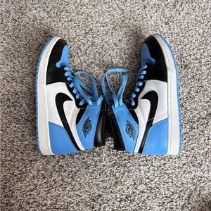 Nike air jordan 1 mids university blue, black, and white